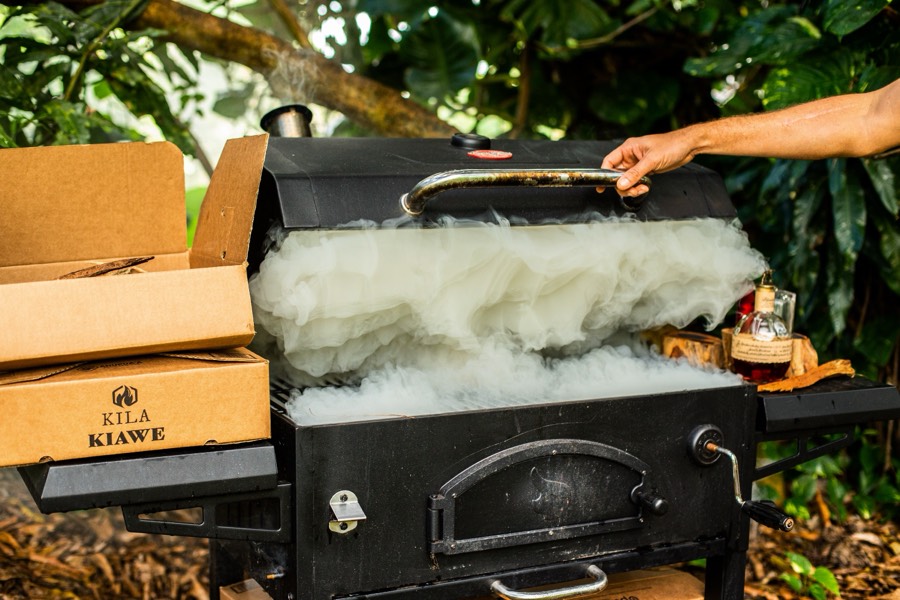Kila Kiawe wood smoking on a backyard grill
